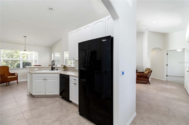 2199 Palm Ct, North Port, FL 34287 - kitchen featuring black appliances, arched walkways, a peninsula, white cabinets, and lofted ceiling