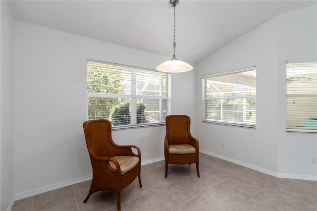 2199 Palm Ct, North Port, FL 34287 - sitting room with vaulted ceiling, healthy amount of natural light, baseboards, and light tile patterned flooring