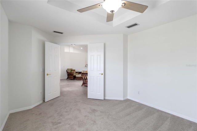 2199 Palm Ct, North Port, FL 34287 - empty room featuring light colored carpet, a ceiling fan, and baseboards