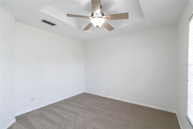 2199 Palm Ct, North Port, FL 34287 - spare room featuring carpet, a raised ceiling, a ceiling fan, and baseboards