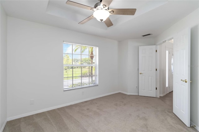 2199 Palm Ct, North Port, FL 34287 - unfurnished bedroom with light carpet, baseboards, and a ceiling fan