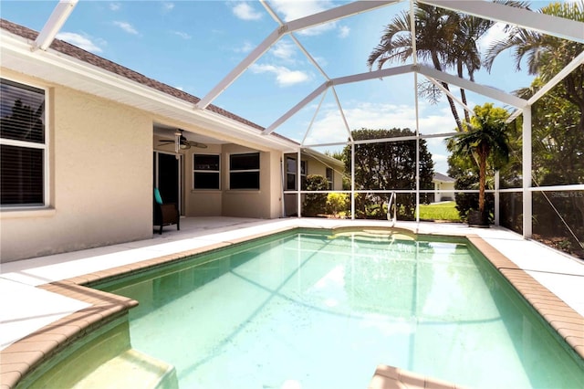 2199 Palm Ct, North Port, FL 34287 - swimming pool with a patio, glass enclosure, and a ceiling fan