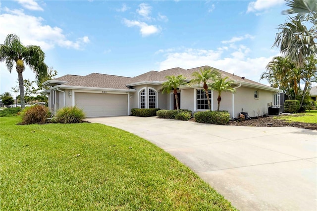 2199 Palm Ct, North Port, FL 34287 - single story home with a garage, concrete driveway, a front lawn, and stucco siding