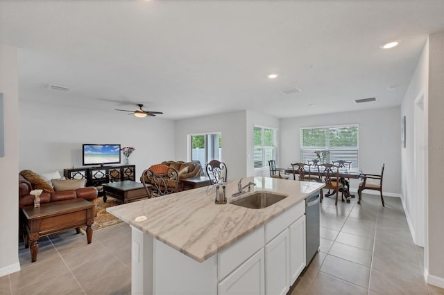 2105 Grand Flora Trl, Bradenton, FL 34208 - kitchen featuring stainless steel dishwasher, a sink, healthy amount of natural light, white cabinetry, and recessed lighting