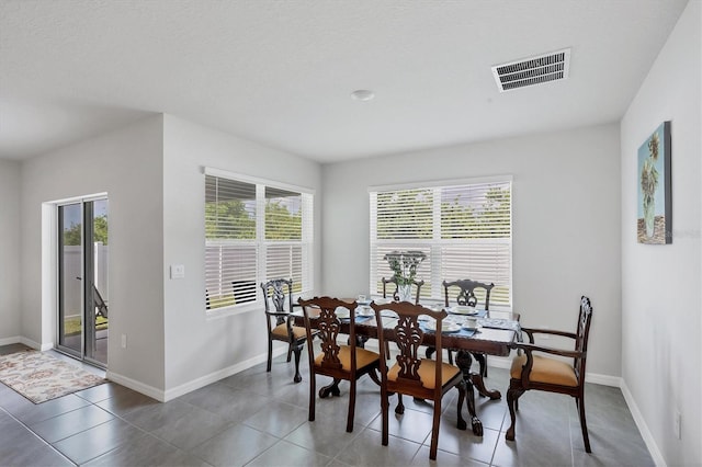 2105 Grand Flora Trl, Bradenton, FL 34208 - dining space featuring baseboards and tile patterned flooring