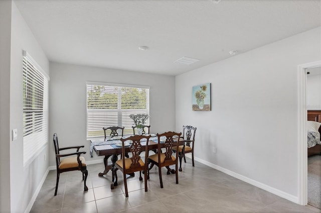 2105 Grand Flora Trl, Bradenton, FL 34208 - dining room with baseboards and light tile patterned floors