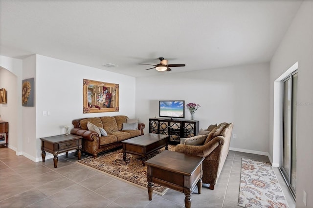 2105 Grand Flora Trl, Bradenton, FL 34208 - tiled living area featuring a ceiling fan, baseboards, and arched walkways