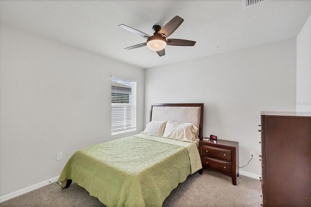 2105 Grand Flora Trl, Bradenton, FL 34208 - carpeted bedroom with baseboards and ceiling fan