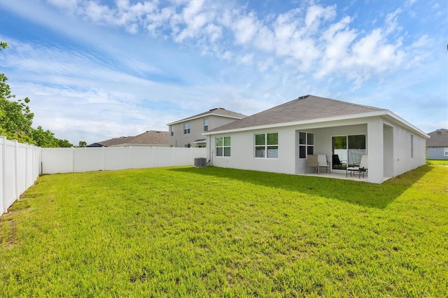 2105 Grand Flora Trl, Bradenton, FL 34208 - rear view of house featuring a patio area, stucco siding, and central AC