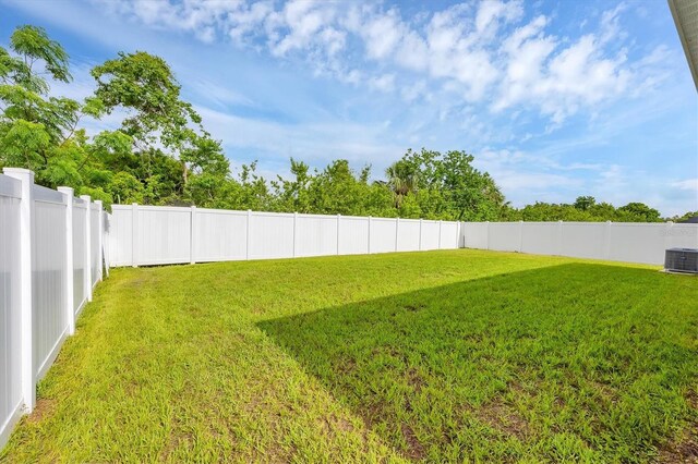 2105 Grand Flora Trl, Bradenton, FL 34208 - view of yard featuring central air condition unit