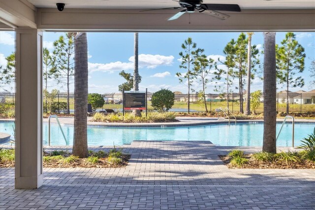 2105 Grand Flora Trl, Bradenton, FL 34208 - community pool with a ceiling fan and a patio