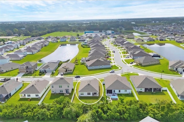 2105 Grand Flora Trl, Bradenton, FL 34208 - aerial perspective of suburban area featuring a large body of water