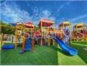 1643 35th St, Sarasota, FL 34234 - community play area featuring a lawn