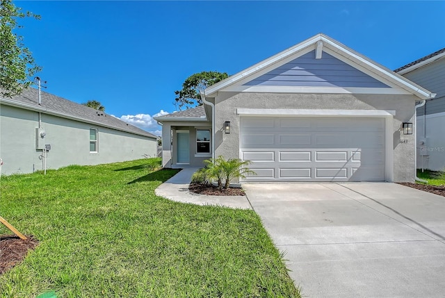 1643 35th St, Sarasota, FL 34234 - single story home featuring stucco siding, a front yard, concrete driveway, and a garage