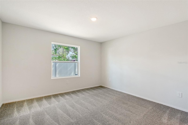 1643 35th St, Sarasota, FL 34234 - carpeted spare room with baseboards and recessed lighting