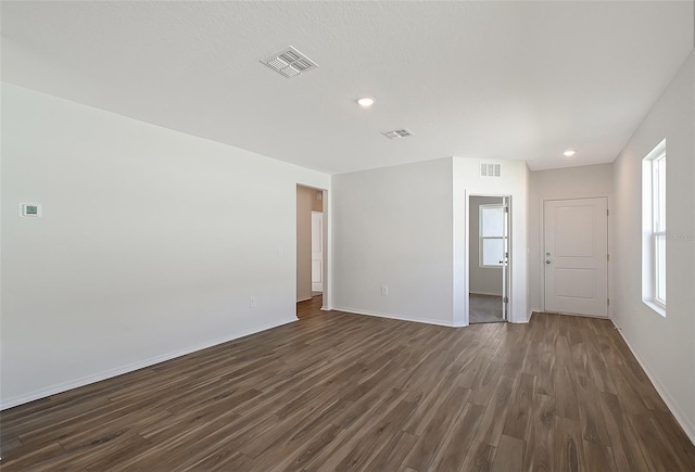 1643 35th St, Sarasota, FL 34234 - unfurnished room featuring dark wood-style flooring, baseboards, and recessed lighting