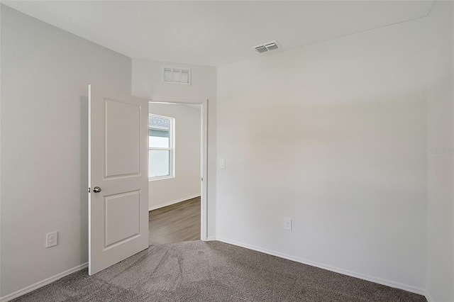 1643 35th St, Sarasota, FL 34234 - carpeted spare room featuring baseboards