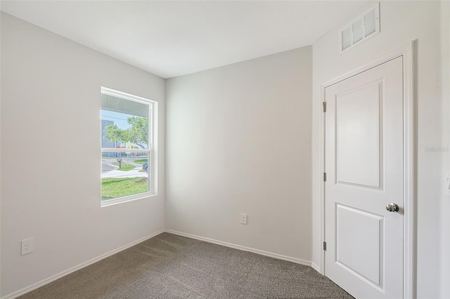 1643 35th St, Sarasota, FL 34234 - empty room featuring carpet and baseboards