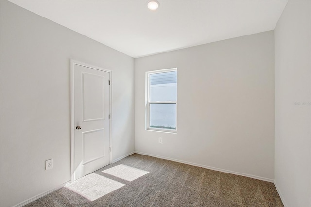 1643 35th St, Sarasota, FL 34234 - unfurnished room featuring carpet flooring and baseboards