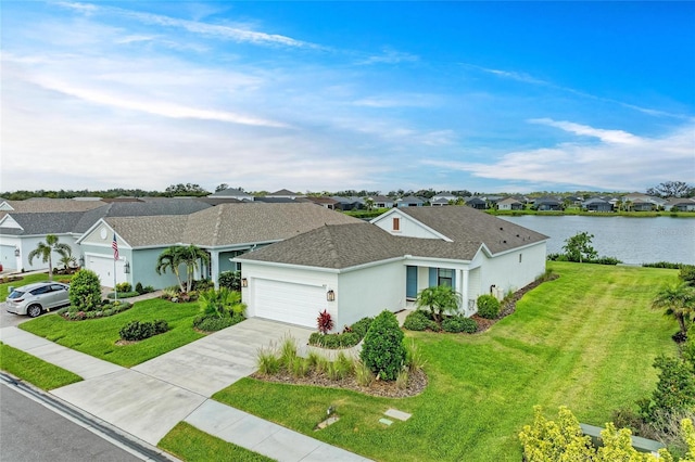 4625 Canoe Creek Ave, Parrish, FL 34219 - view of front of property with a garage, a residential view, a front yard, driveway, and a water view