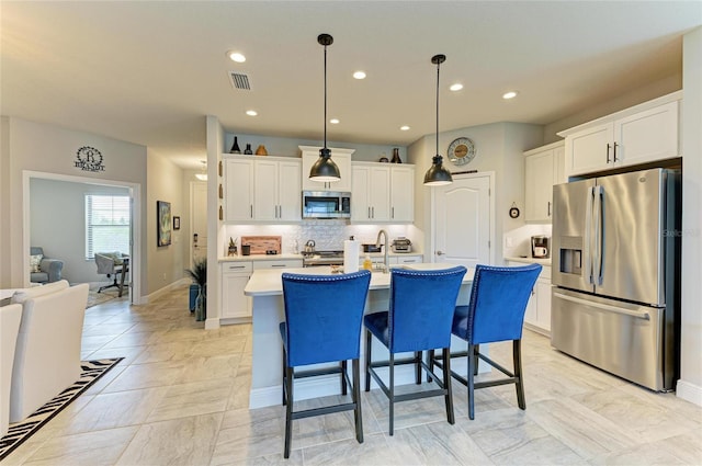 4625 Canoe Creek Ave, Parrish, FL 34219 - kitchen with appliances with stainless steel finishes, light countertops, white cabinets, and recessed lighting