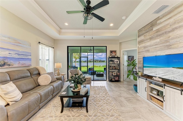 4625 Canoe Creek Ave, Parrish, FL 34219 - living area with ceiling fan, a tray ceiling, wood walls, and recessed lighting