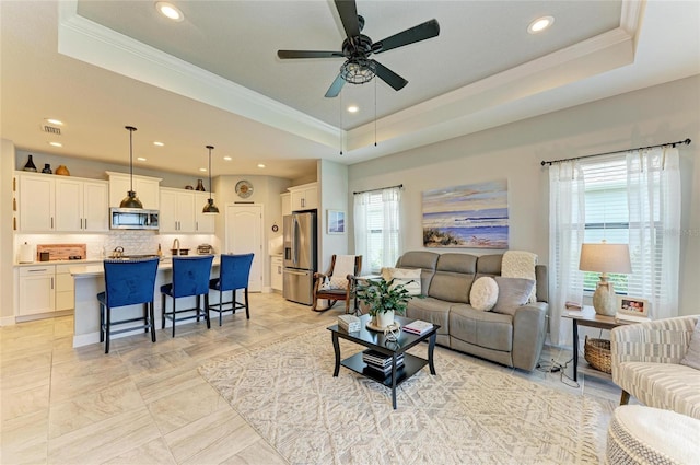 4625 Canoe Creek Ave, Parrish, FL 34219 - living area with a raised ceiling, crown molding, recessed lighting, and ceiling fan