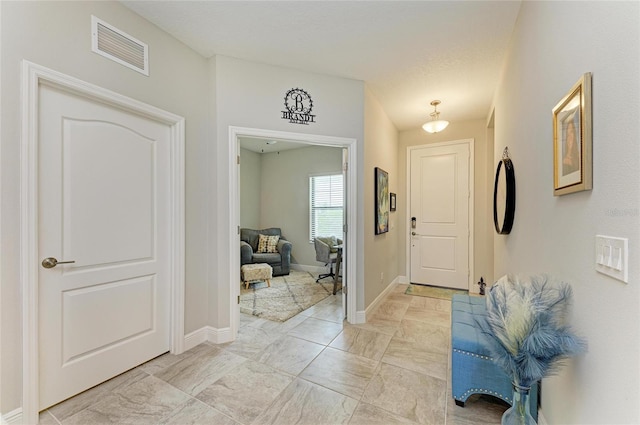 4625 Canoe Creek Ave, Parrish, FL 34219 - foyer entrance with baseboards