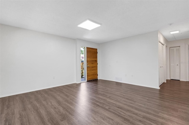 5356 Royal Palm Ave Unit 5356, Sarasota, FL 34234 - empty room featuring dark wood-style flooring and baseboards