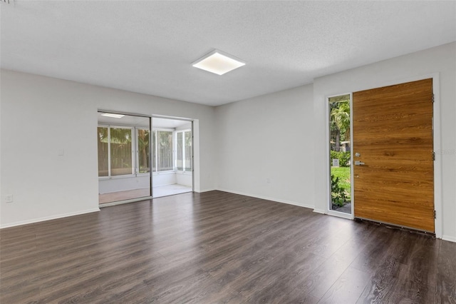 5356 Royal Palm Ave Unit 5356, Sarasota, FL 34234 - spare room featuring healthy amount of natural light, wood finished floors, and baseboards