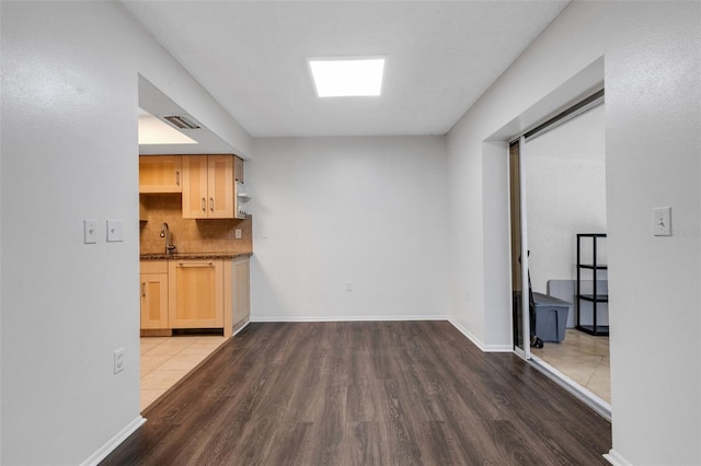 5356 Royal Palm Ave Unit 5356, Sarasota, FL 34234 - unfurnished living room with wood finished floors, a sink, and baseboards