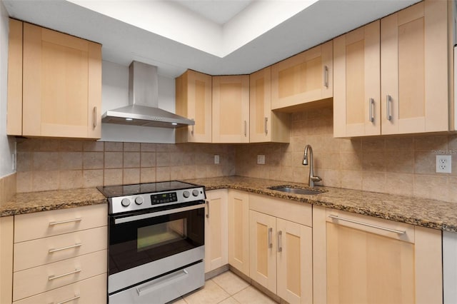 5356 Royal Palm Ave Unit 5356, Sarasota, FL 34234 - kitchen featuring wall chimney range hood, stainless steel range with electric cooktop, a sink, and decorative backsplash