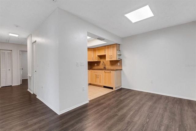 5356 Royal Palm Ave Unit 5356, Sarasota, FL 34234 - unfurnished living room featuring wood finished floors and baseboards