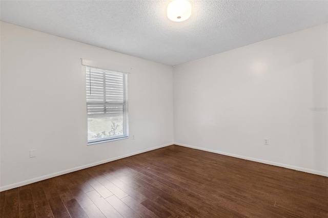 5356 Royal Palm Ave Unit 5356, Sarasota, FL 34234 - unfurnished room with wood finished floors, baseboards, and a textured ceiling