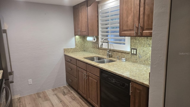 5325 Murdock Ave, Sarasota, FL 34231 - kitchen with dishwasher, a sink, decorative backsplash, light wood-style flooring, and light stone countertops