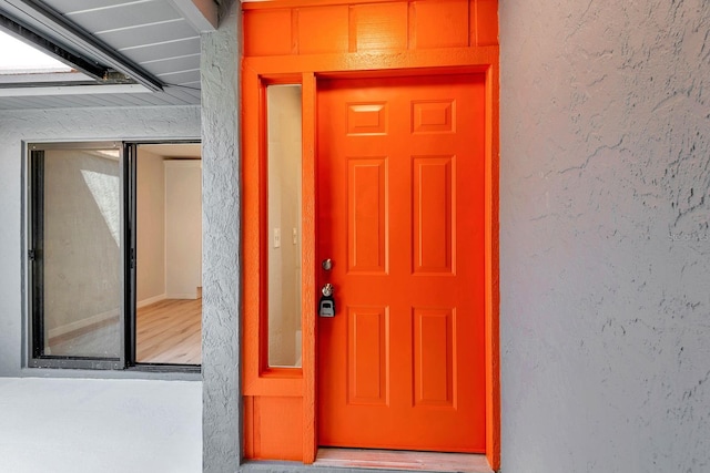 5192 Cedar Hammock Ln, Sarasota, FL 34232 - view of exterior entry featuring stucco siding