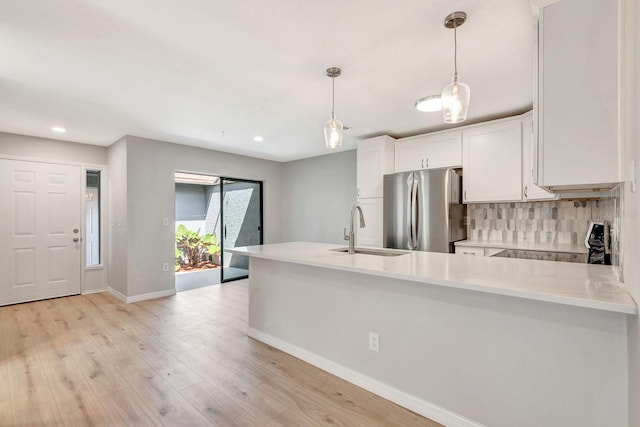 5192 Cedar Hammock Ln, Sarasota, FL 34232 - kitchen featuring freestanding refrigerator, a sink, baseboards, electric range oven, and light countertops
