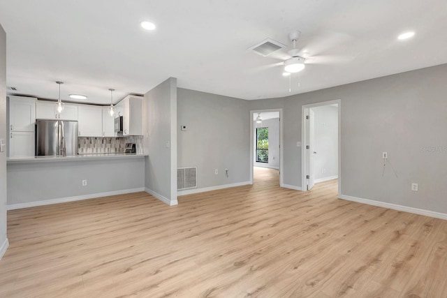 5192 Cedar Hammock Ln, Sarasota, FL 34232 - unfurnished living room with a ceiling fan, baseboards, light wood-style flooring, and recessed lighting