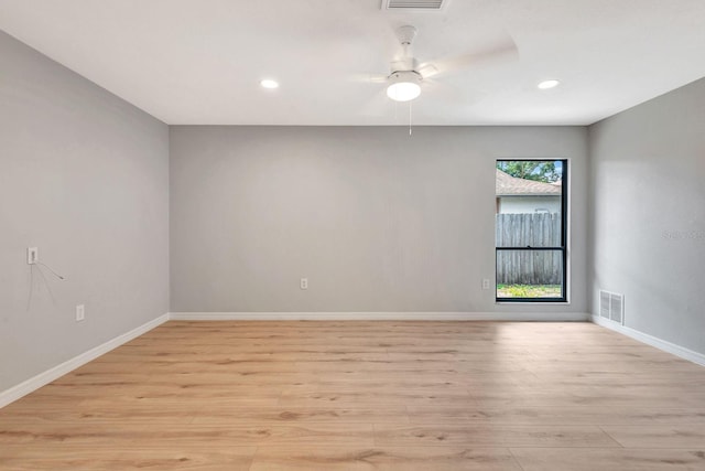 5192 Cedar Hammock Ln, Sarasota, FL 34232 - empty room with light wood-type flooring, a ceiling fan, recessed lighting, and baseboards