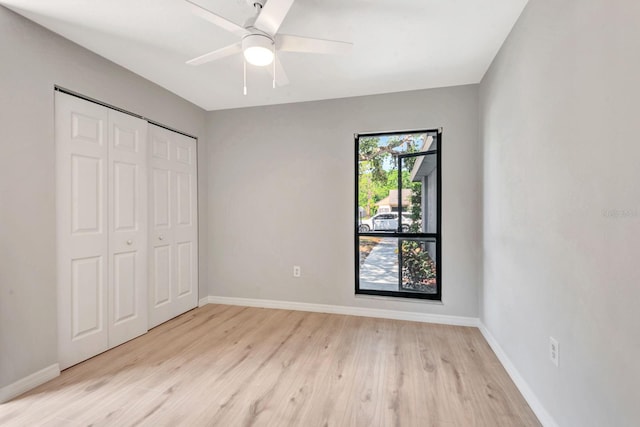 5192 Cedar Hammock Ln, Sarasota, FL 34232 - unfurnished bedroom featuring light wood-type flooring, baseboards, and a closet