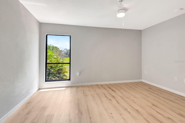 5192 Cedar Hammock Ln, Sarasota, FL 34232 - unfurnished room with light wood finished floors, baseboards, and ceiling fan