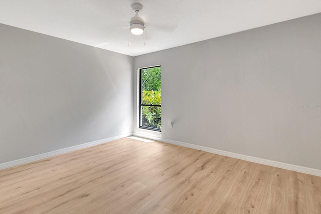5192 Cedar Hammock Ln, Sarasota, FL 34232 - empty room with baseboards, light wood-style floors, and a ceiling fan