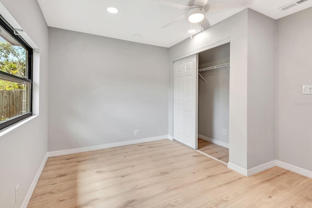 5192 Cedar Hammock Ln, Sarasota, FL 34232 - unfurnished bedroom with wood finished floors, a closet, baseboards, and recessed lighting