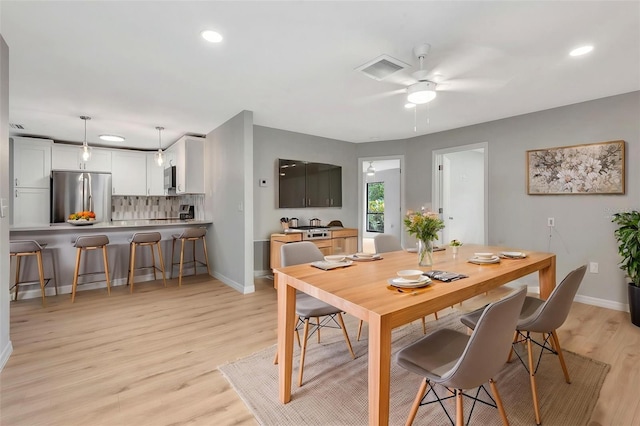 5192 Cedar Hammock Ln, Sarasota, FL 34232 - dining area featuring baseboards, light wood-style floors, ceiling fan, and recessed lighting