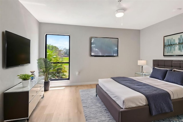 5192 Cedar Hammock Ln, Sarasota, FL 34232 - bedroom with light wood-style flooring and baseboards