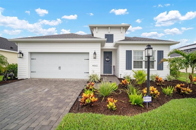 10423 Morning Marsh Ln, Parrish, FL 34219 - view of front of house featuring decorative driveway and a garage