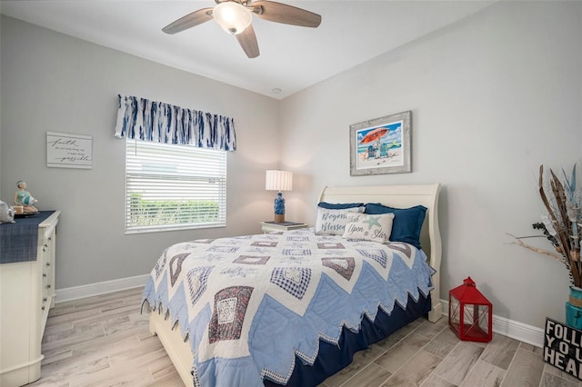 10423 Morning Marsh Ln, Parrish, FL 34219 - bedroom with wood finished floors, baseboards, and ceiling fan