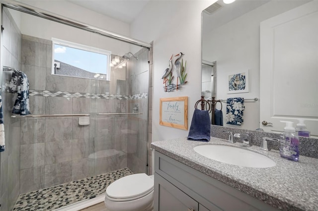 10423 Morning Marsh Ln, Parrish, FL 34219 - bathroom featuring vanity, toilet, and a shower stall