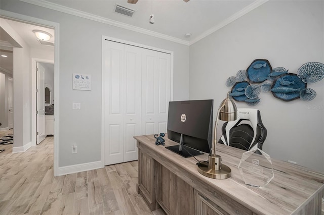 10423 Morning Marsh Ln, Parrish, FL 34219 - home office featuring light wood-type flooring, crown molding, baseboards, a ceiling fan, and arched walkways