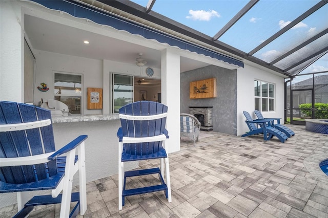 10423 Morning Marsh Ln, Parrish, FL 34219 - view of patio with exterior fireplace and glass enclosure